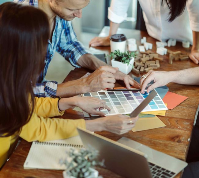 creative business meeting with caucasian and asian co worker discuss with paper laptop and happiness and joyful cafe background